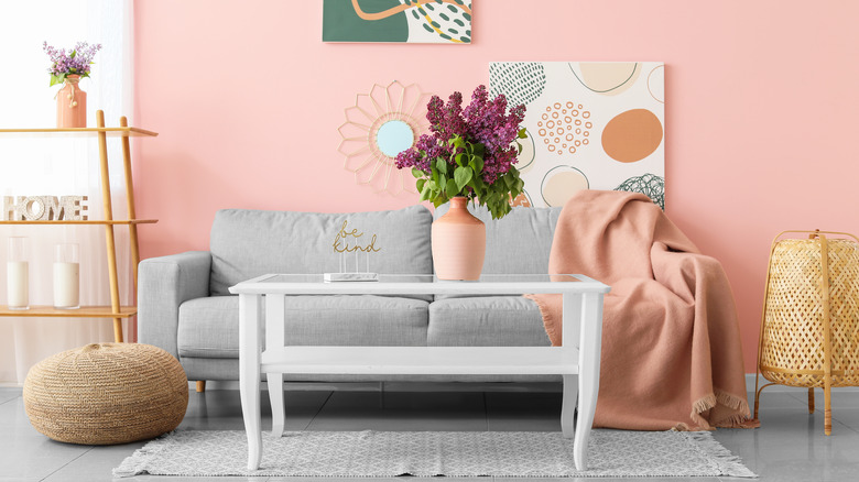 gray couch in pink room