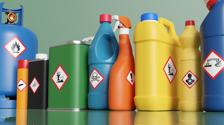 A selection of flammable products lined up on a mirrored surface.