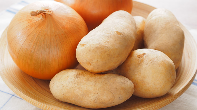 A bowl of onions and potatoes