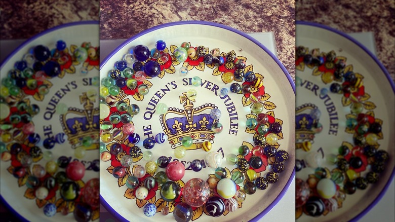 vintage tray with crown holding marble collection