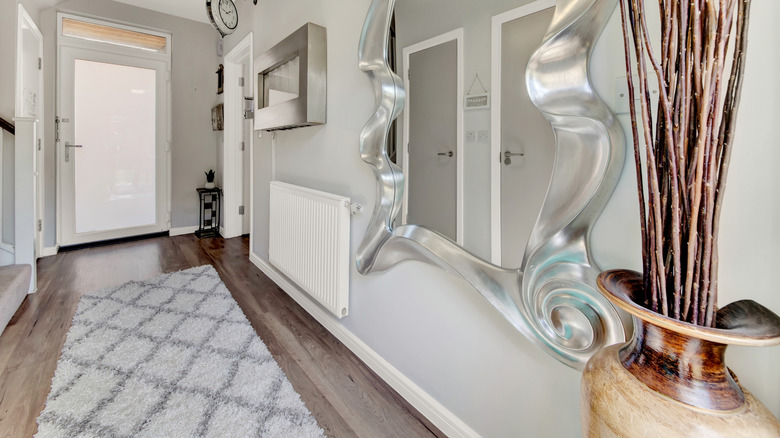 Entryway with a runner rug on a hardwood floor