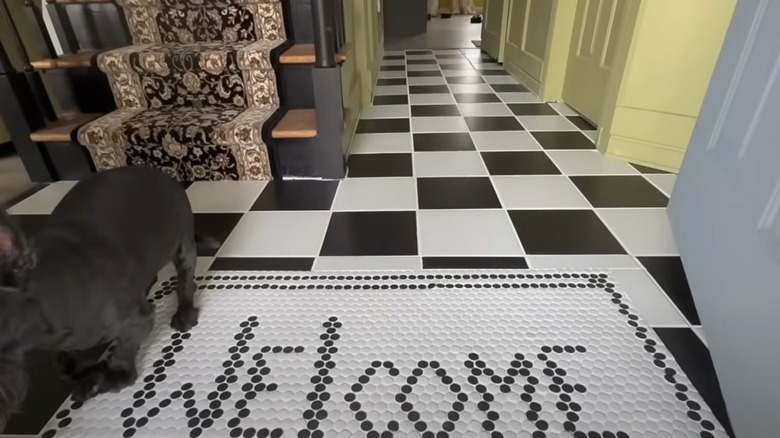 Entryway with black and white tiles