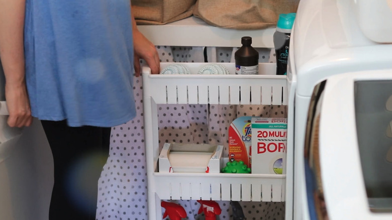 Person pulling out sliding shelf