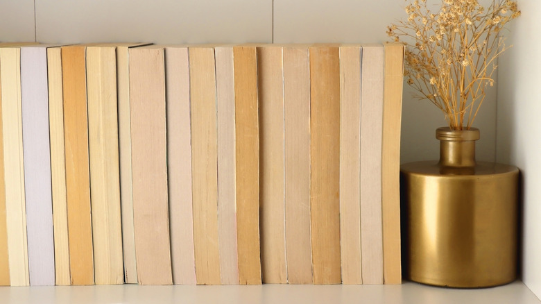 Closeup of books turned backwards on a shelf