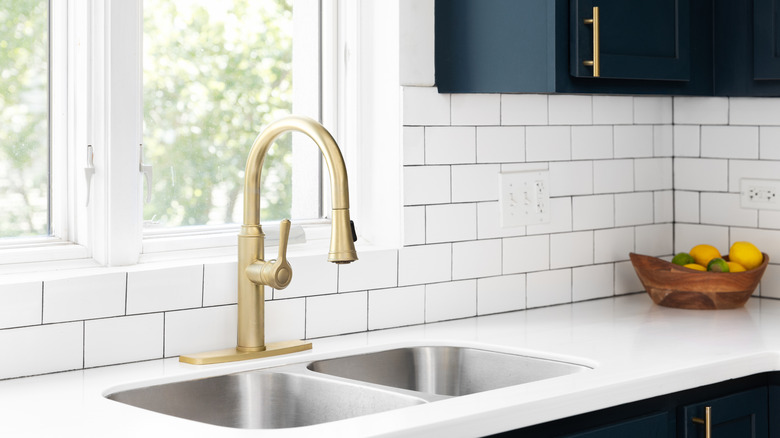 Gold-toned kitchen sink fixture