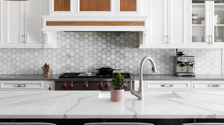 Kitchen island with a sink in the center
