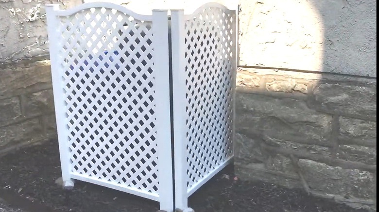 Premade panels creating a two-sided outdoor cover for trash cans