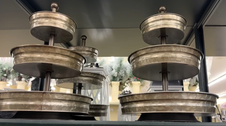 Galvenized three-tiered metal trays on the shelf in a Hobby Lobby