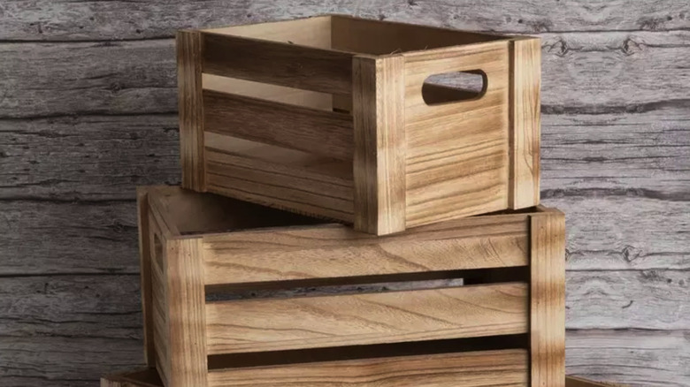 rustic wood crates stacked in front of a wood background