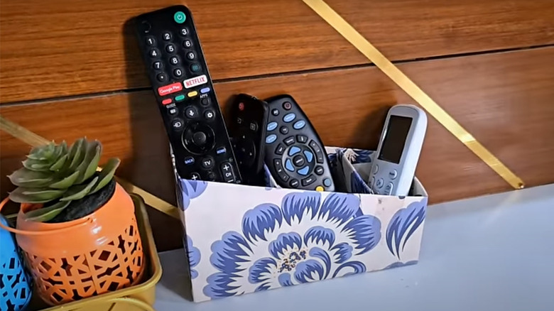 A simple container to house different size remote controls