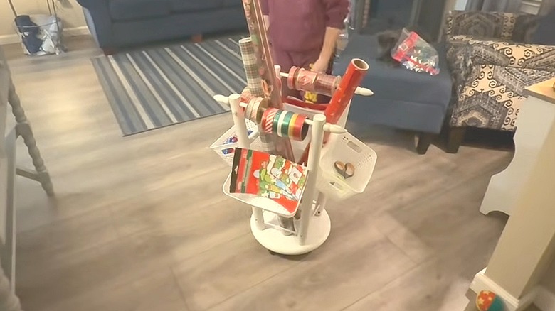 Upside-down wood stool turned into a wrapping paper holder