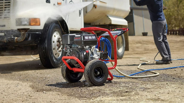 Man uses Predator's 4400 PSI commercial-duty washer to wash a large truck