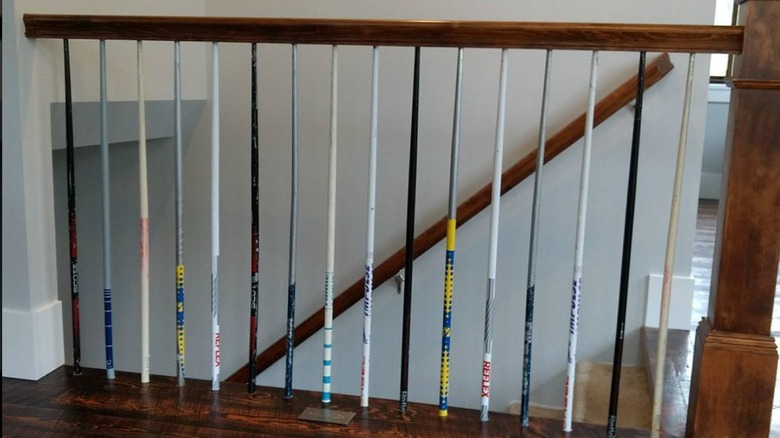 Numerous ski poles as stair railings.