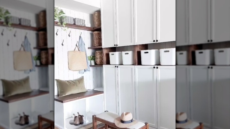 white billy bookcases in mudroom holding white baskets