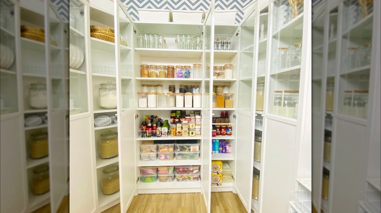 kitchen pantry made from bookcases filled with food