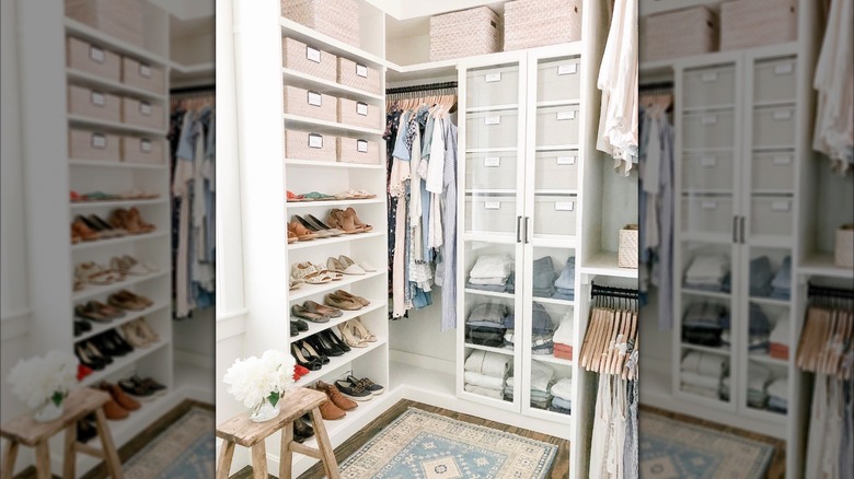 white billy bookcases as a closet with clothes, shoes, and organizers on it