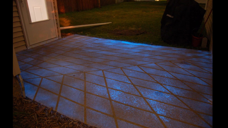 A concrete driveway painted with glow-in-the-dark paint.