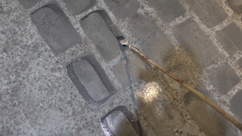 A painted cobblestone effect on a driveway.