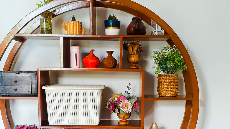 A shelf filled with various knick-knacks and decorative items