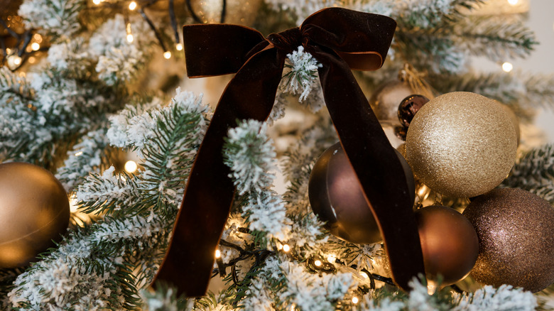 Christmas tree with a velvet bow on it