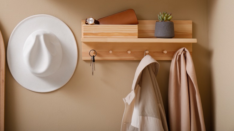 jacket and keys on wall hooks