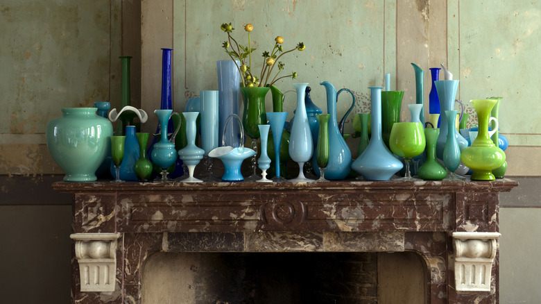 blue and green glassware on mantel