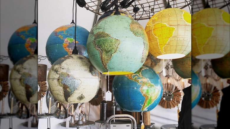 Five different hanging globe light fixture designs