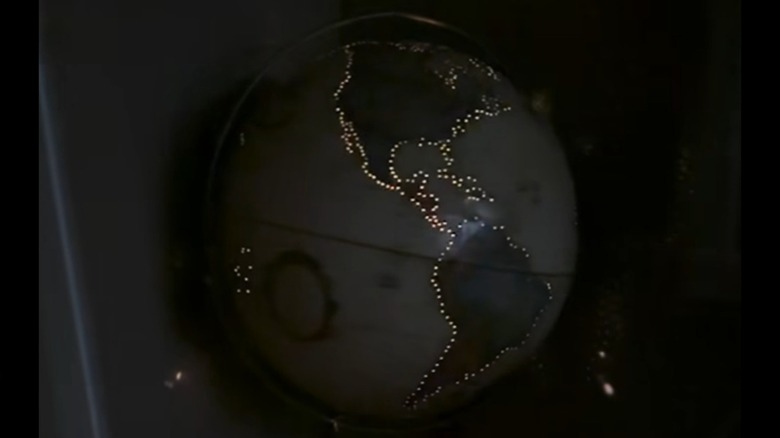 A globe light illuminating a dark room