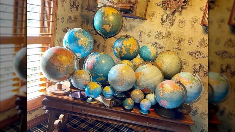 A large globe grouping on a wooden table