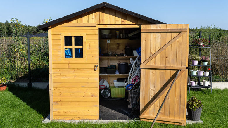 Wooden shade with open door in backyard