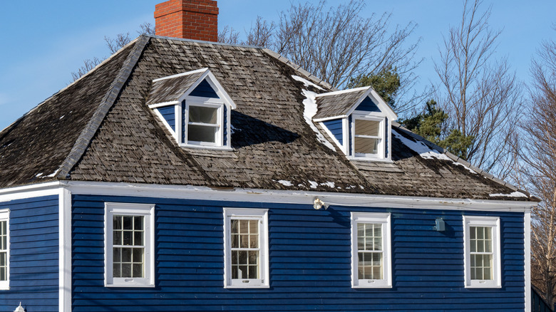 Blue house with dormer windows