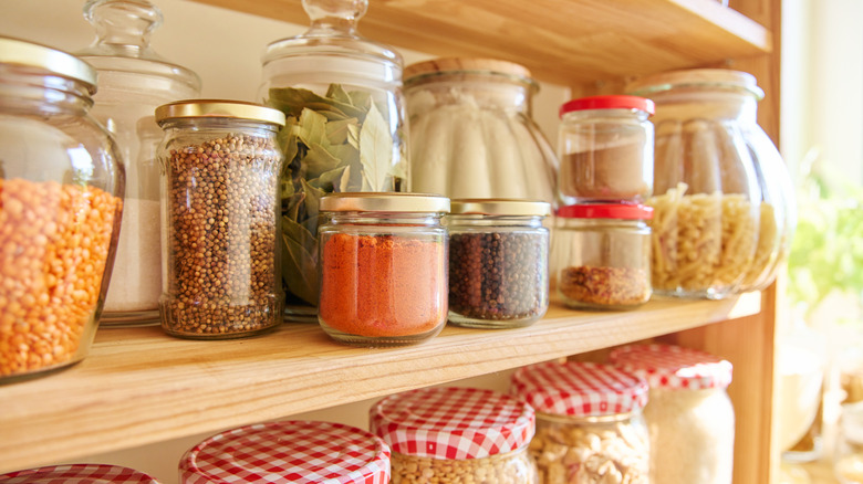 Jars of ingredients on pantry shelves