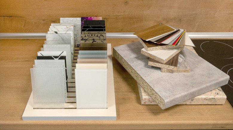 Small samples of various countertop materials in a showroom