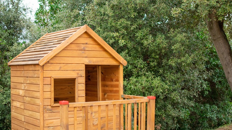 warm wood square treehouse 