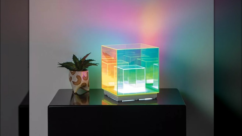 Iridescent acrylic lamp on shelf
