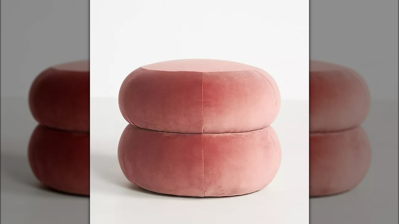 Pink velvet ottoman white background