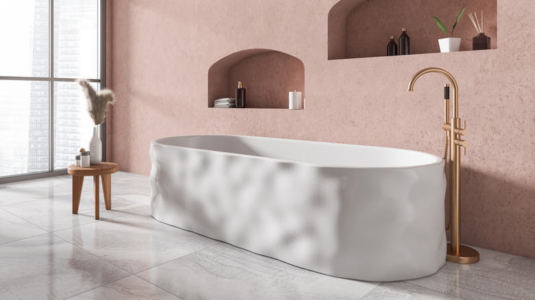 bathtub in a pink room