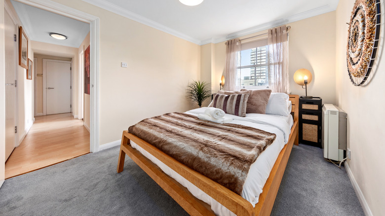 Inviting bedroom with neutral tones and modern decor.