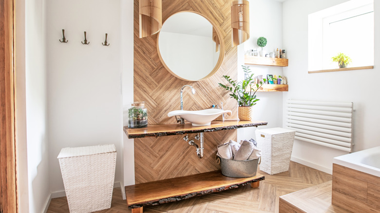 bathroom with wood countertop