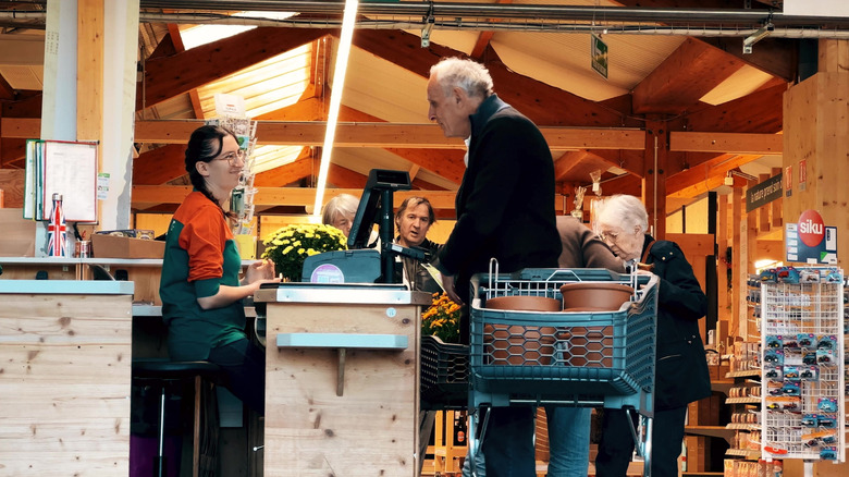 Customers checking out at a garden center
