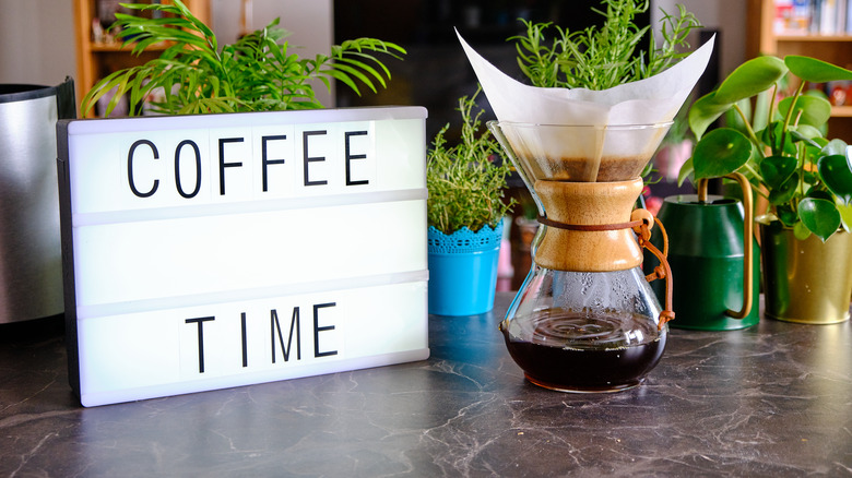 coffee with sign and plants