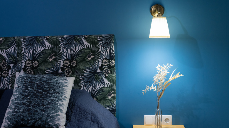 sconce over bedroom end table