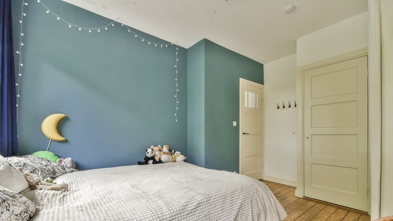string lights along blue wall