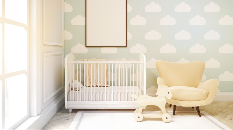Nursery with cloud wallpaper