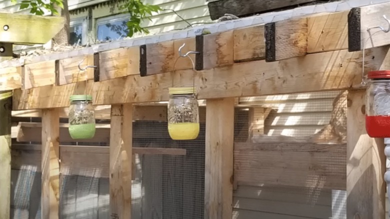 jar lanterns on fence