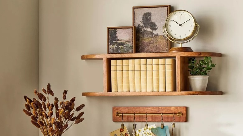 Small clock on a wall shelf