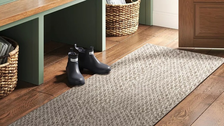 Patterned runner rug in a mudroom