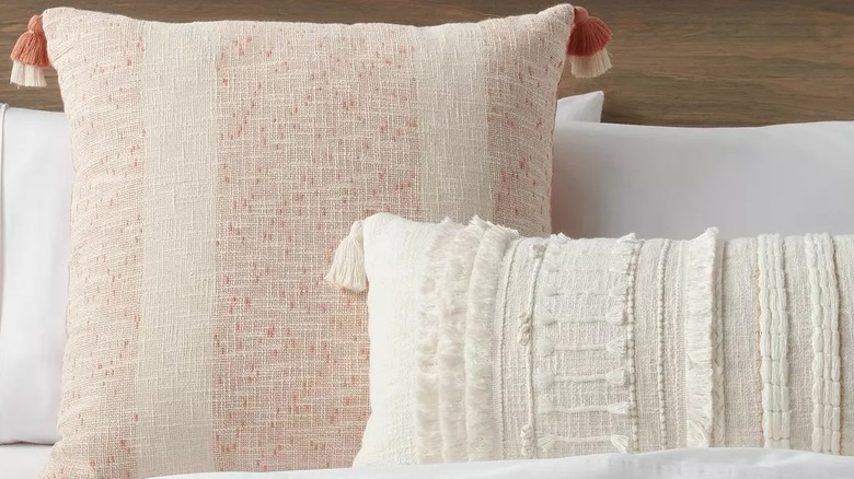 Closeup of throw pillows on a bed