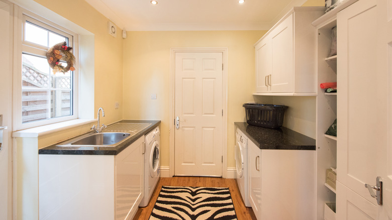 Laundry room with a zebra-print runner rug