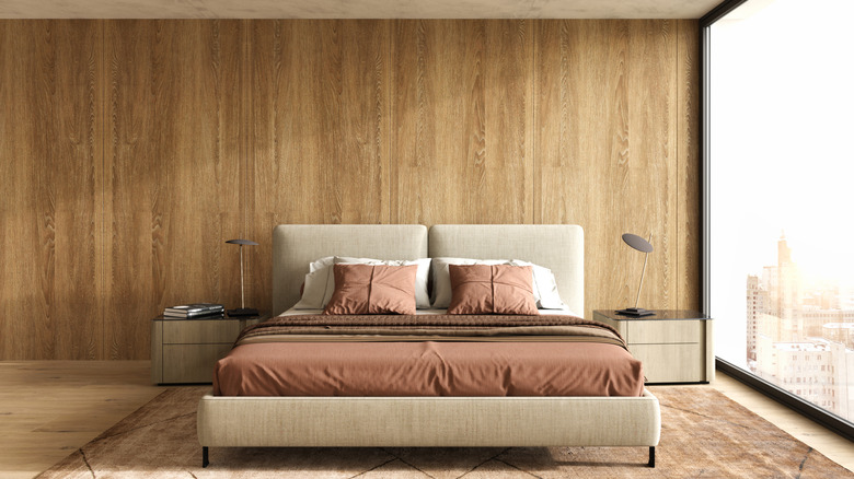 Bedroom with a wood panelled accent wall